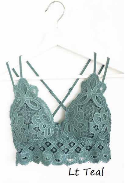 Light Teal Crochet Lace Bralette   Pull over style, long line, all day comfort V neckline  Removal bra pads  Criss-cross straps at back  Adjustable straps with perfect amount of stretch  Fabric: 90% nylon, 10% spandex  Crochet Lace Bralette   Pull over style, long line, all day comfort V neckline  Removal bra pads  Criss-cross straps at back  Adjustable straps with perfect amount of stretch  Fabric: 90% nylon, 10% spandex  