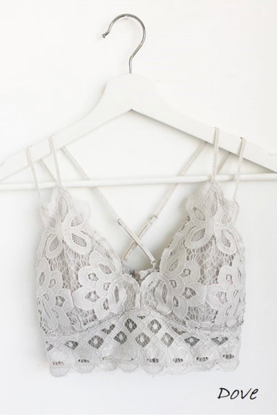 Dove Crochet Lace Bralette   Pull over style, long line, all day comfort V neckline  Removal bra pads  Criss-cross straps at back  Adjustable straps with perfect amount of stretch  Fabric: 90% nylon, 10% spandex  