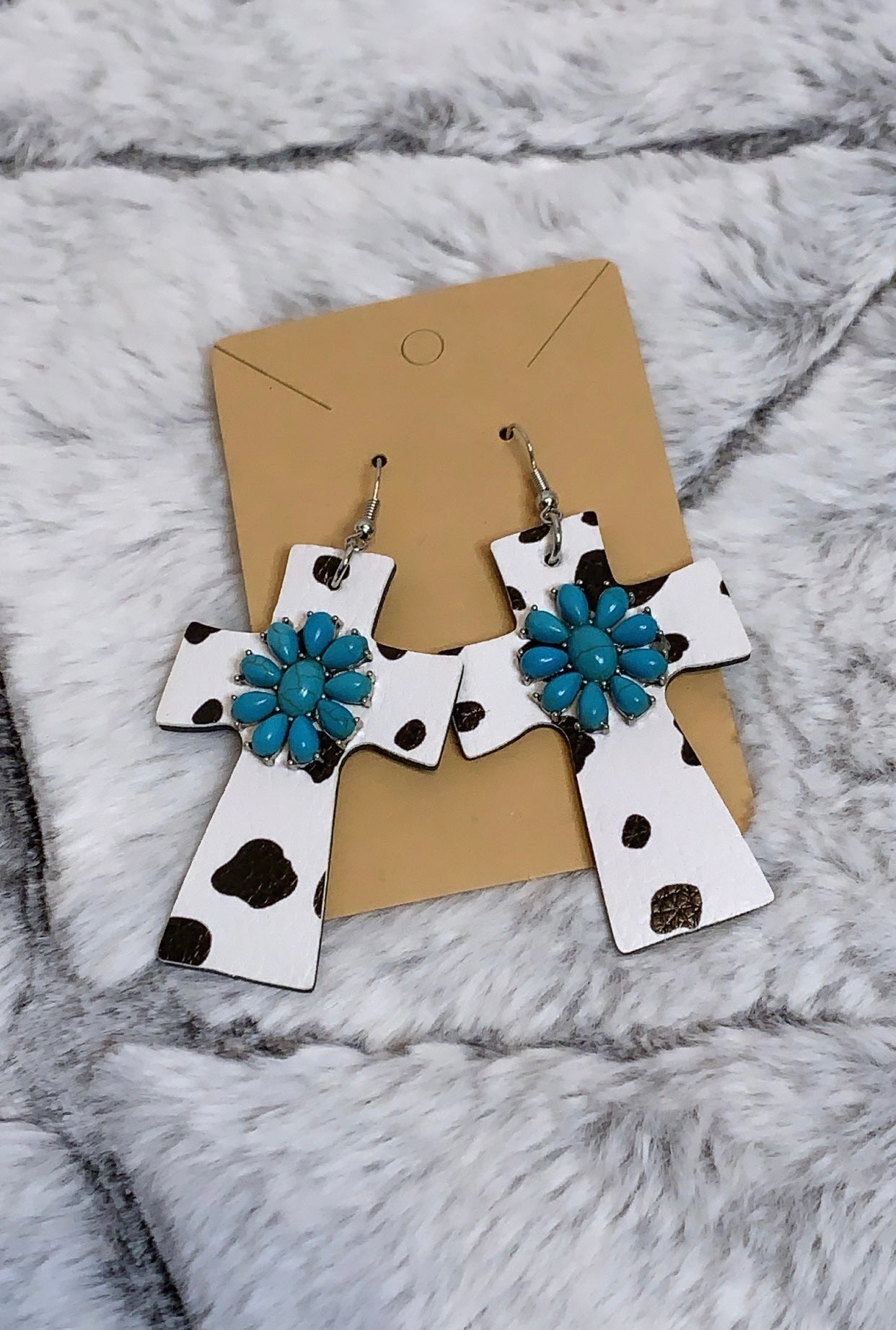 Light weight turquoise center detail leather cow print cross earrings. *Lead Compliant 