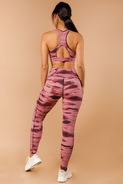 Two-piece tie dye activewear set  Two-toned color shades The Sports Bra DOES NOT have padding  Matching slimming high waist leggings  Hidden back phone pocket at the waist  Elastic waist