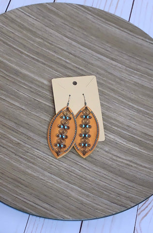 Light weight tan genuine leather carving detail earrings. *Lead Compliant 