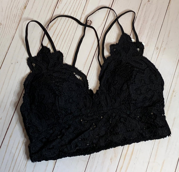 Black Crochet Lace Bralette   Pull over style, long line, all day comfort V neckline  Removal bra pads  Criss-cross straps at back  Adjustable straps with perfect amount of stretch  Fabric: 90% nylon, 10% spandex  