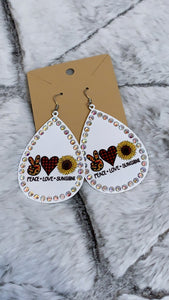 White Peace*Love*Sunshine metal earrings *Medium weight *Detailed with iridescent stones *Weight 0.6oz *Lead Compliant