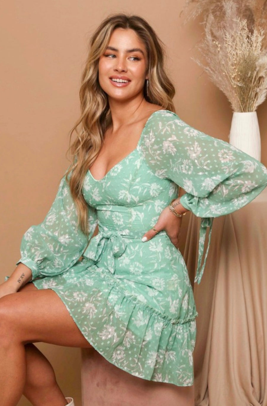 Mint/Ivory floral print swiss dress Long tie cuff sleeves  belted with tiered skirt and zipper closure on the back 